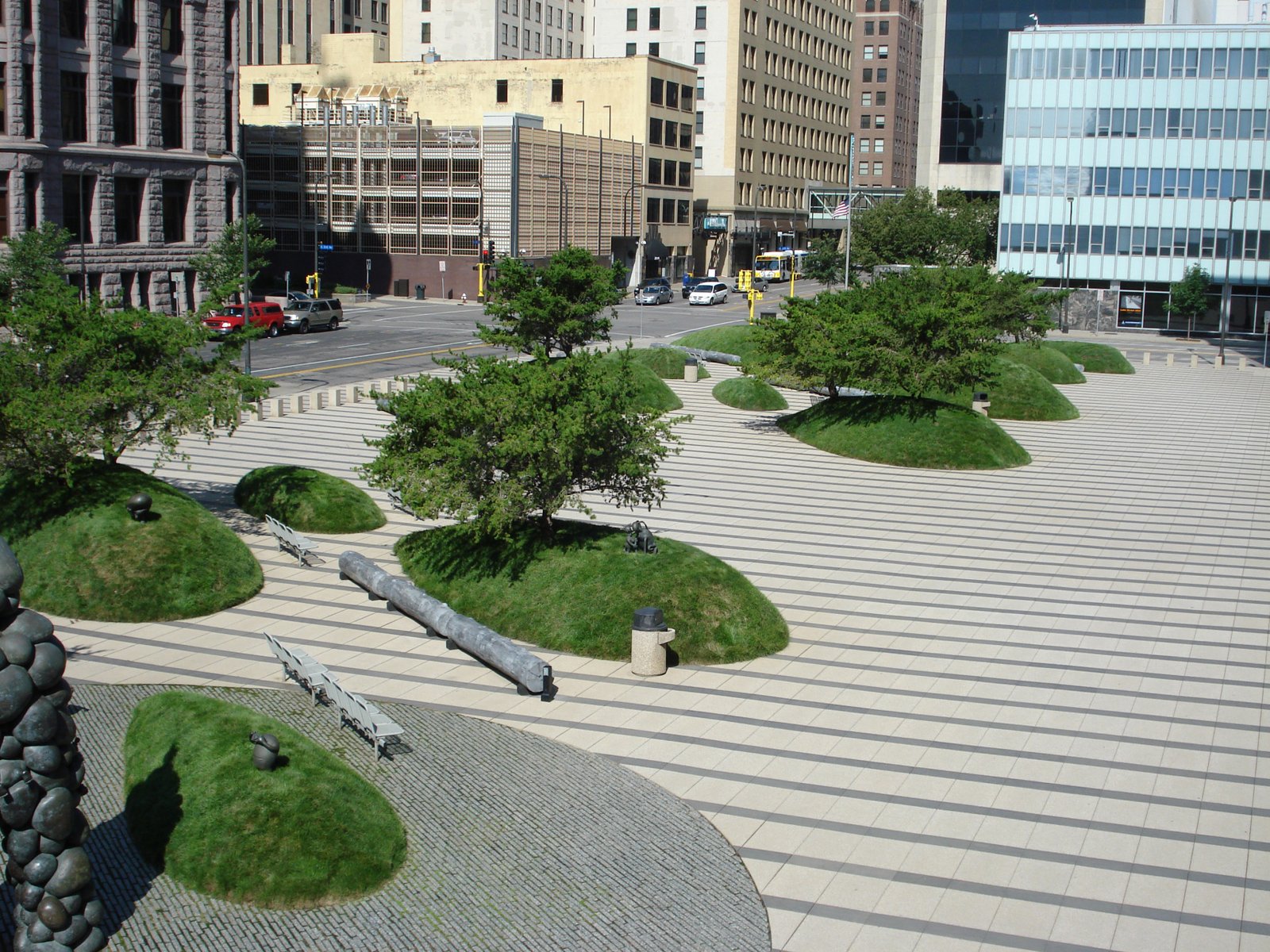 Federal Courthouse Minneapolis MN. Designed by Martha Schwartz Partners, these turf mounds represent drumlin deposits left by glaciers but are actually a clever security feature protecting the buildings while providing artistic and environmental int…